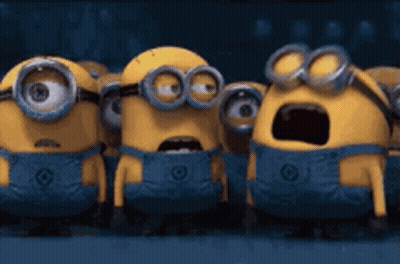 A Group Of Minions Standing Next To Each Other With Their Mouths Open GIF