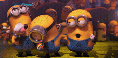 A Group Of Minions With G On Their Overalls Are Standing Together GIF