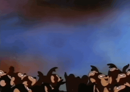 A Group Of Monkeys Are Looking Up At Something In The Sky GIF
