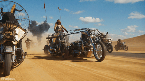 A Group Of Motorcycles Are Driving Down A Dirt Road With The Hashtag #Furiosa GIF