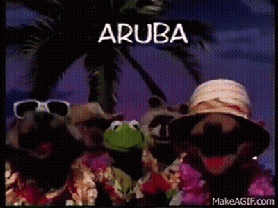 A Group Of Muppets Are Standing Next To Each Other In Front Of A Palm Tree . GIF