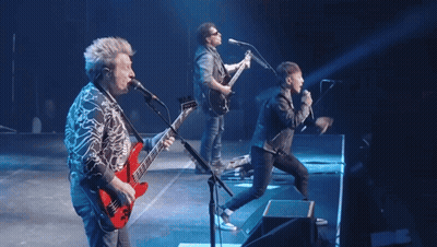 a group of musicians are on stage with the word don 't in red