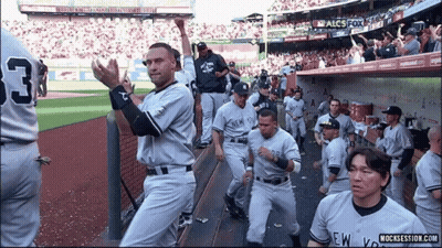 A Group Of New York Yankees Baseball Players Standing On The Field GIF