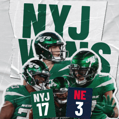 A Group Of Ny Jets Players Are Holding Up Signs GIF