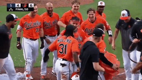 A Group Of Orioles Baseball Players Are Celebrating A Win GIF
