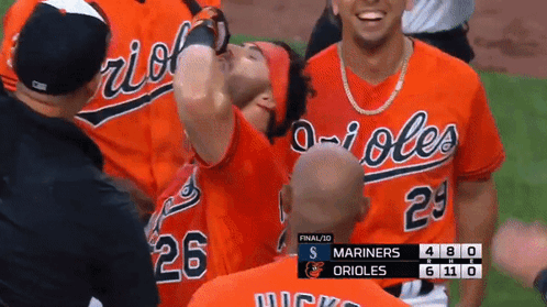 A Group Of Orioles Baseball Players Celebrate A Win Over The Mariners GIF