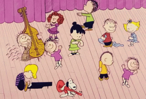 A Group Of Peanuts Characters Are Dancing And Playing Instruments GIF