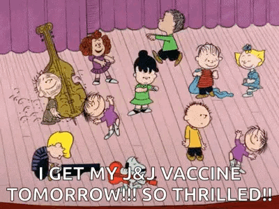 A Group Of Peanuts Characters Are Dancing On A Stage With A Cello In The Background . GIF