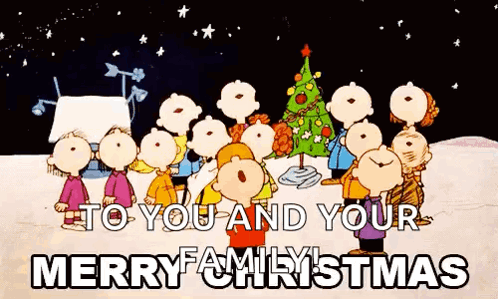 A Group Of Peanuts Characters Are Standing Around A Christmas Tree And Singing . GIF