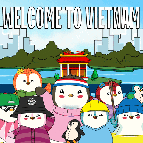 A Group Of Penguins Are Standing In Front Of A Welcome To Vietnam Poster GIF