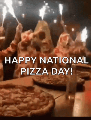 A Group Of People Are Celebrating National Pizza Day With Sparklers . GIF