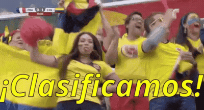 A Group Of People Are Cheering In A Stadium And They Are Wearing Yellow Shirts That Say Clasificamos ! GIF