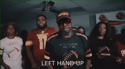 A Group Of People Are Cheering With The Words " The Commanders " Written On The Bottom GIF