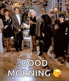A Group Of People Are Dancing At A Party And A Woman Is Dancing In Front Of Them . GIF