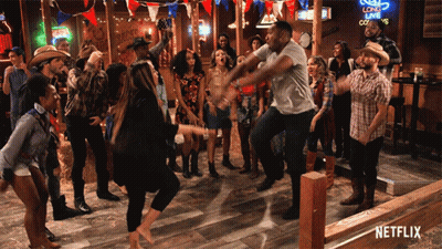 A Group Of People Are Dancing In A Bar With A Netflix Logo In The Corner GIF