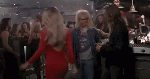 A Group Of People Are Dancing In A Bar With The Word Schwing Written On The Bottom . GIF
