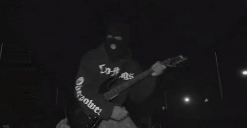 A Group Of People Are Dancing In A Black And White Photo . GIF