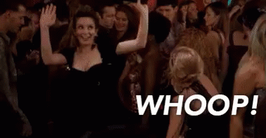 A Group Of People Are Dancing In A Club And A Woman Is Dancing In The Middle Of A Crowd . GIF