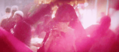A Group Of People Are Dancing In A Club With Pink Smoke Coming Out Of The Ceiling . GIF