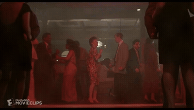A Group Of People Are Dancing In A Dark Room And The Word Movieclips Is On The Bottom Right GIF