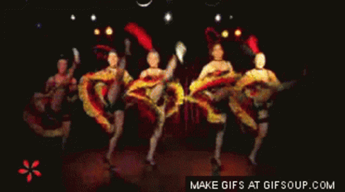 A Group Of People Are Dancing In A Dark Room And The Words Make Gifs At Gifsoup.com Are Visible GIF