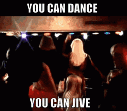 A Group Of People Are Dancing In A Dark Room With The Words " You Can Dance You Can Jive " Above Them GIF