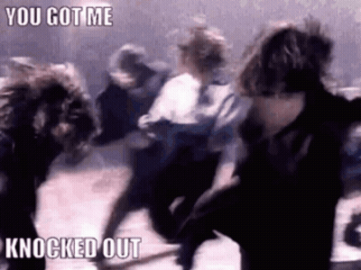 A Group Of People Are Dancing In A Dark Room With The Words `` You Got Me Knocked Out '' . GIF