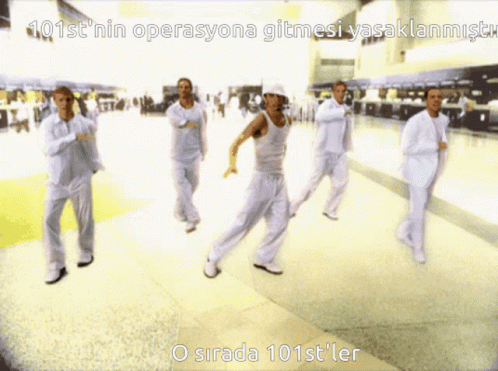 A Group Of People Are Dancing In A Hallway With The Words 101St ' Nin Operasyona Gitmesi Yasaklanmistr GIF