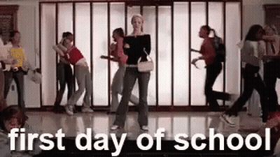 A Group Of People Are Dancing In A Hallway With The Words `` First Day Of School '' Above Them . GIF