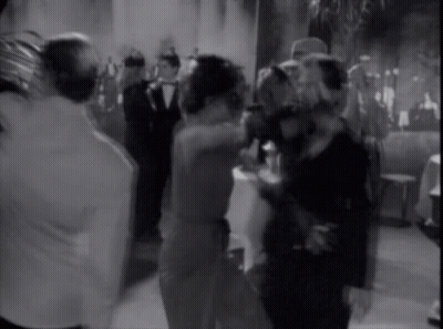 A Group Of People Are Dancing In A Room GIF