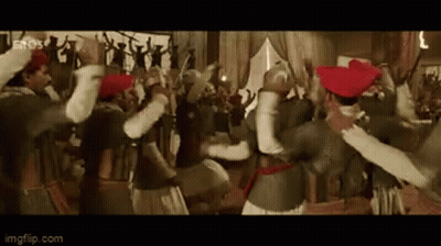 A Group Of People Are Dancing In A Room In A Movie . GIF