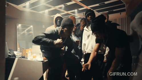 A Group Of People Are Dancing In A Room With A Gifrun.com Watermark GIF