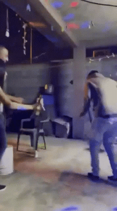 A Group Of People Are Dancing In A Room With A Sign That Says " A " On It GIF