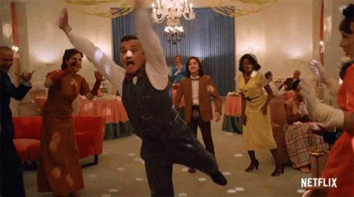 A Group Of People Are Dancing In A Room With Netflix Written On The Bottom GIF