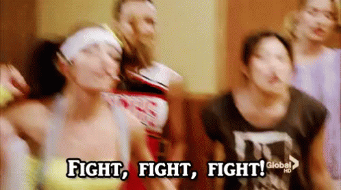 A Group Of People Are Dancing In A Room With The Words `` Fight , Fight , Fight '' Written On The Bottom . GIF