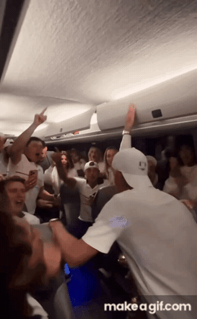 A Group Of People Are Dancing In A Room With The Words Make A Gif.com At The Bottom Of The Screen GIF