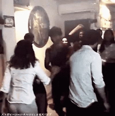 A Group Of People Are Dancing In A Room With The Words Xxbeyondangelsxxx Written On The Bottom GIF