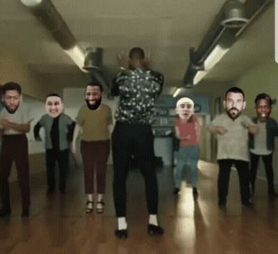 A Group Of People Are Dancing In A Room With Their Faces On Them GIF
