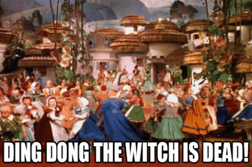 A Group Of People Are Dancing In A Village With The Words Ding Dong The Witch Is Dead GIF