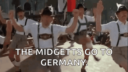 A Group Of People Are Dancing In Front Of A Crowd And The Words `` The Midgets Go To Germany '' Are Written On The Botto GIF
