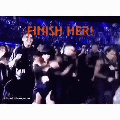 A Group Of People Are Dancing In Front Of A Sign That Says Finish Her . GIF
