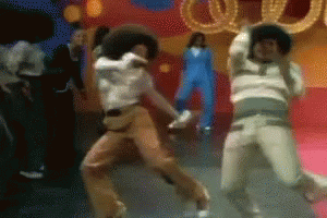 Group Dancing In Front Of O Sign GIF