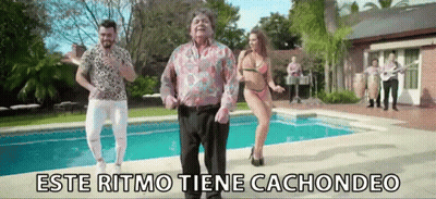 A Group Of People Are Dancing In Front Of A Swimming Pool With The Words Este Ritmo Tiene Cachondeo On The Bottom GIF