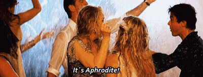A Group Of People Are Dancing In The Rain And One Of Them Is Saying It 'S Aphrodite GIF