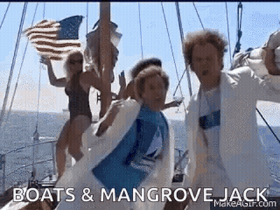 A Group Of People Are Dancing On A Boat In The Ocean While Holding An American Flag . GIF