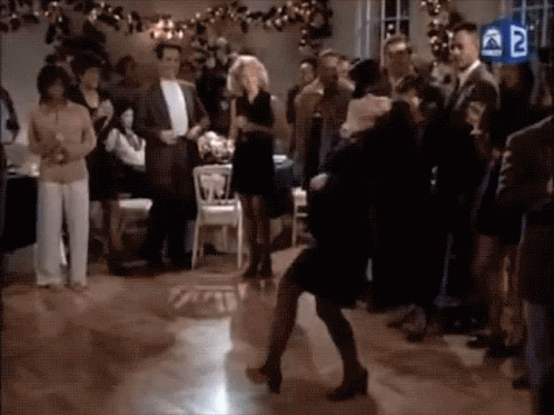 A Group Of People Are Dancing On A Dance Floor At A Party . GIF