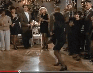 A Group Of People Are Dancing On A Dance Floor GIF