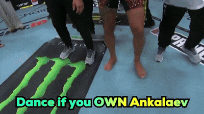 A Group Of People Are Dancing On A Monster Mat GIF