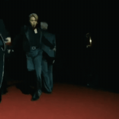 A Group Of People Are Dancing On A Red Carpet GIF