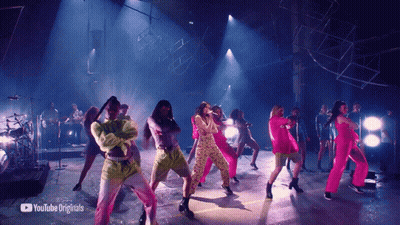 A Group Of People Are Dancing On A Stage With Youtube Originals In The Corner GIF